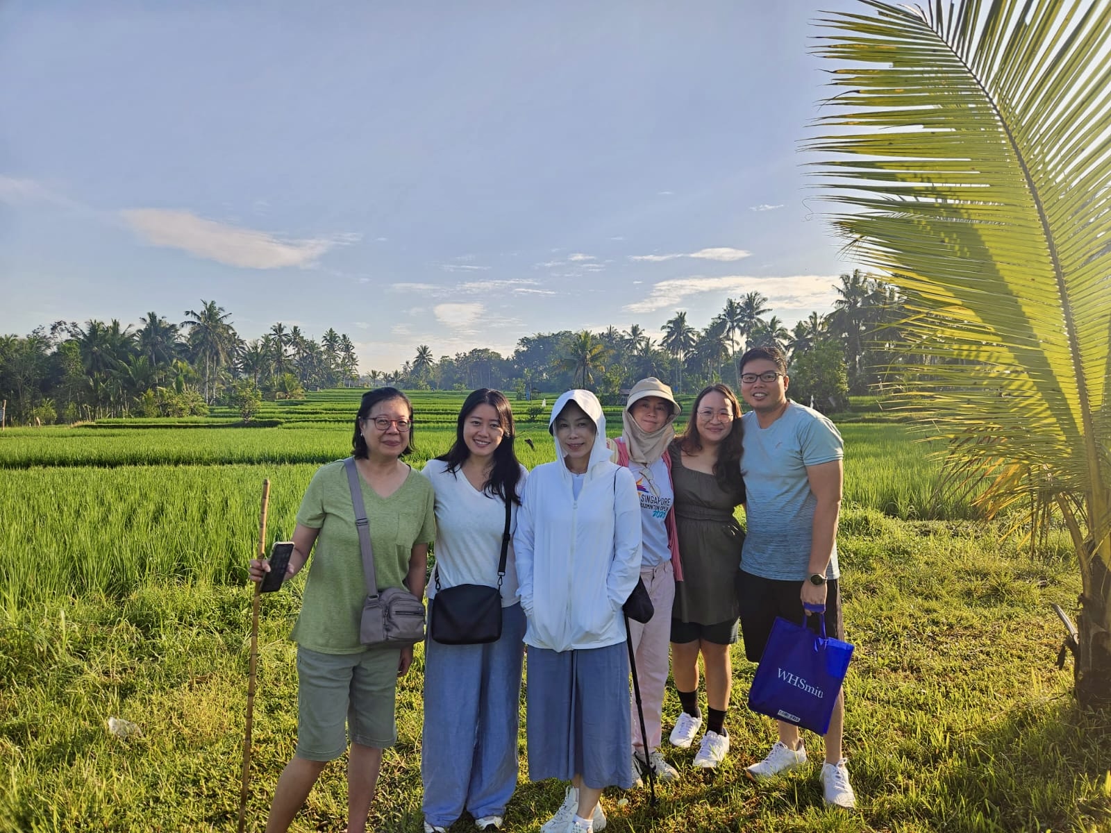 Retreatants pausing by the paddy fields in Ubud
