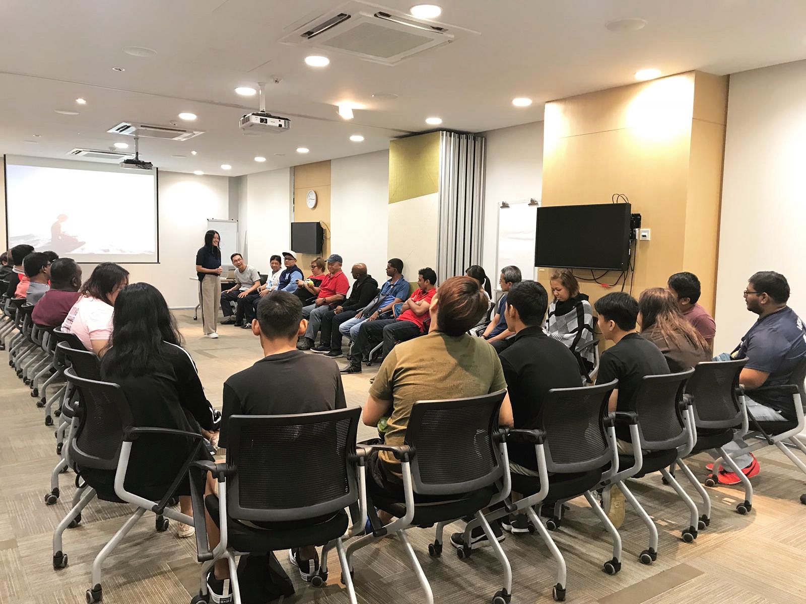 Erin facilitating a workplace wellbeing session in Sentosa